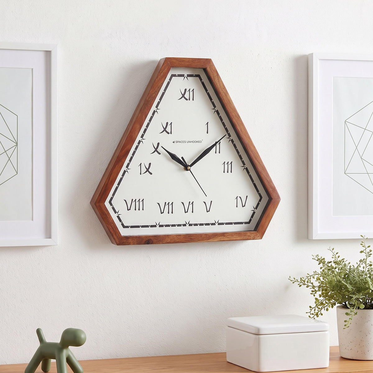 Warm reddish-brown triangular wooden frame with natural grain and clipped corners, close-up view