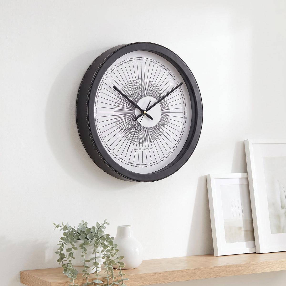 Spaces Unhooked Round Wall Clock, Sunburst Line Art Dial, Black Frame
