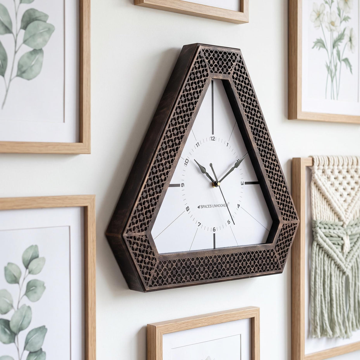 Close-up of the bronze-finish lattice pattern on a triangular clock frame
