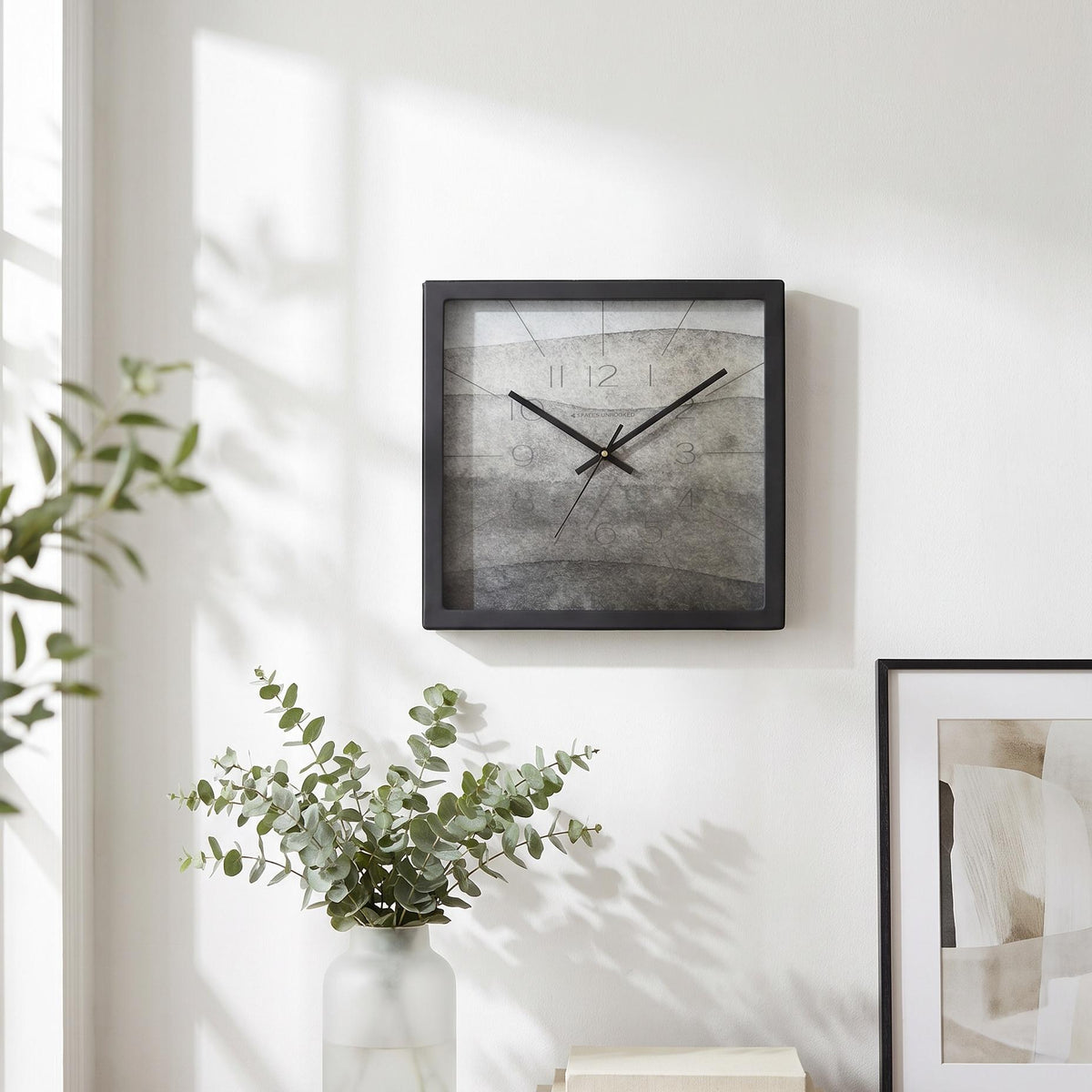 Spaces Unhooked logo above the brass-toned centre cap on an ash grey dial