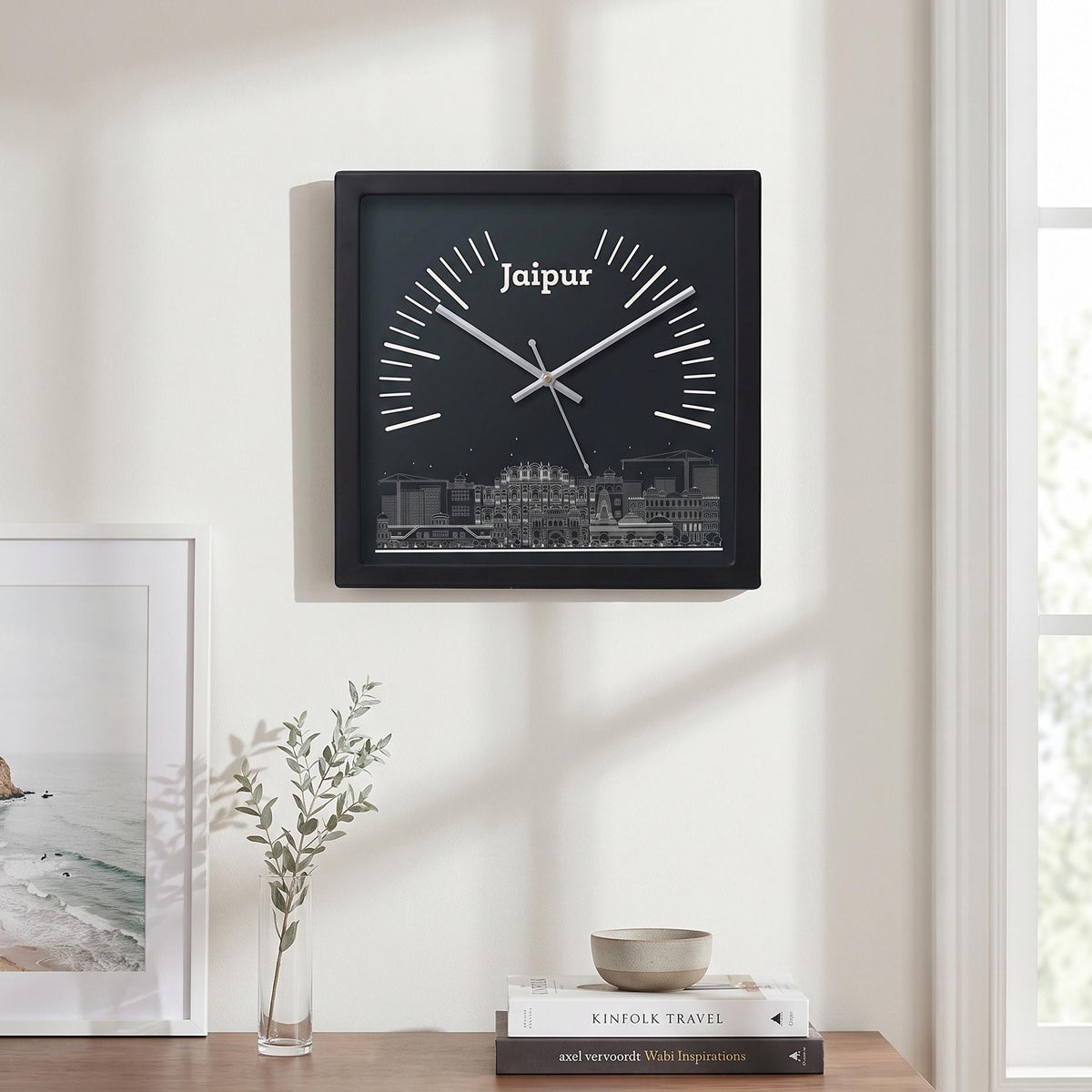 Spaces Unhooked logo above the brass-toned centre cap on a Jaipur skyline clock dial
