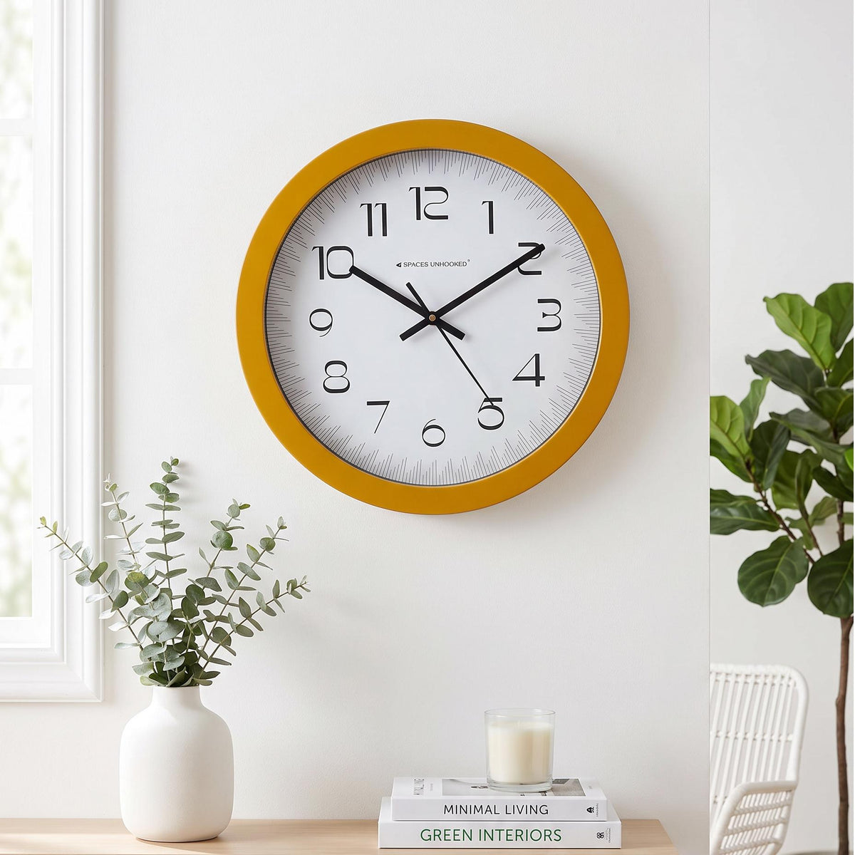 Bold numerals 1 to 12 in a modern rounded style on a mustard yellow round wall clock