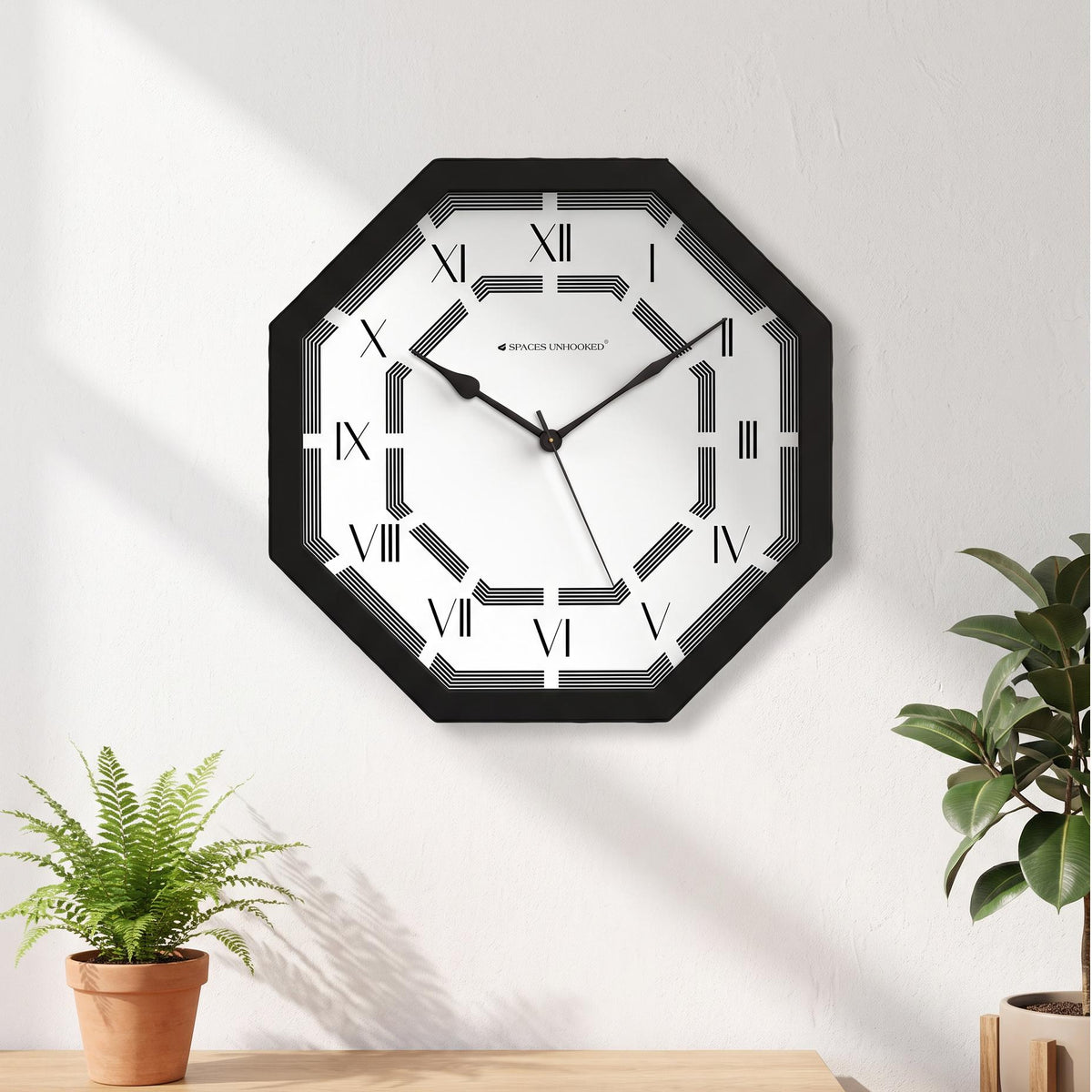 Black octagonal wall clock frame with sharp clean edges, close-up view