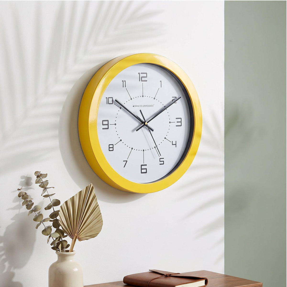 Thin lines linking each dot to a squared-off numeral on a modern white clock dial