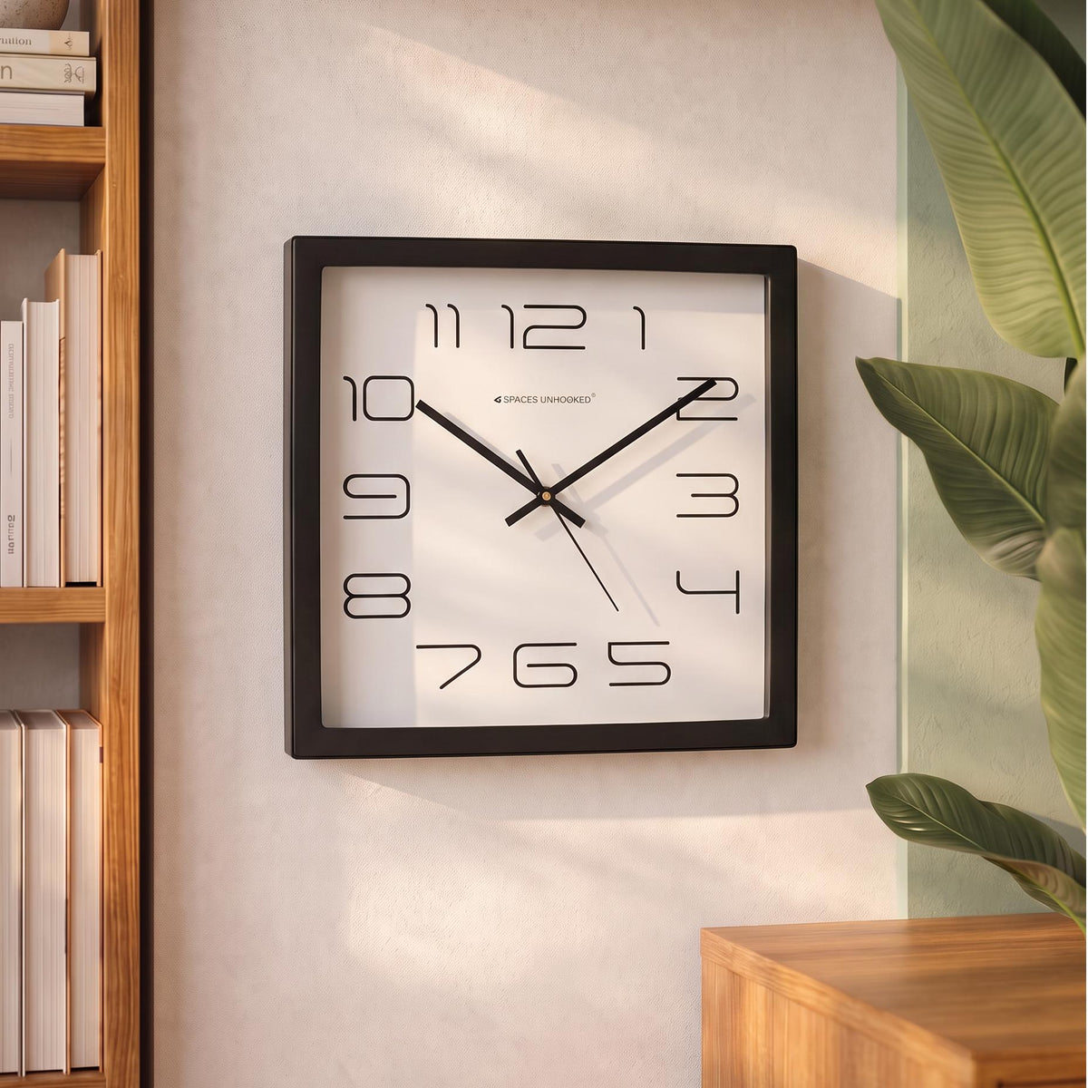 Black square wall clock frame with an even border, close-up view