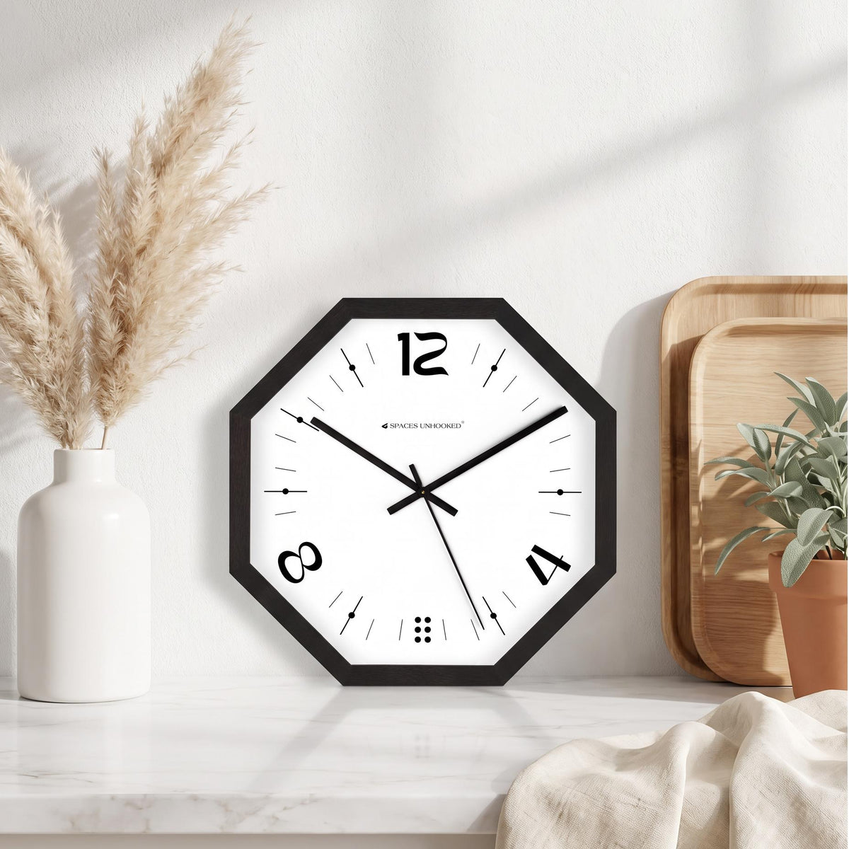 Dot cluster at the base and fine tick markers on a white dial inside a black frame