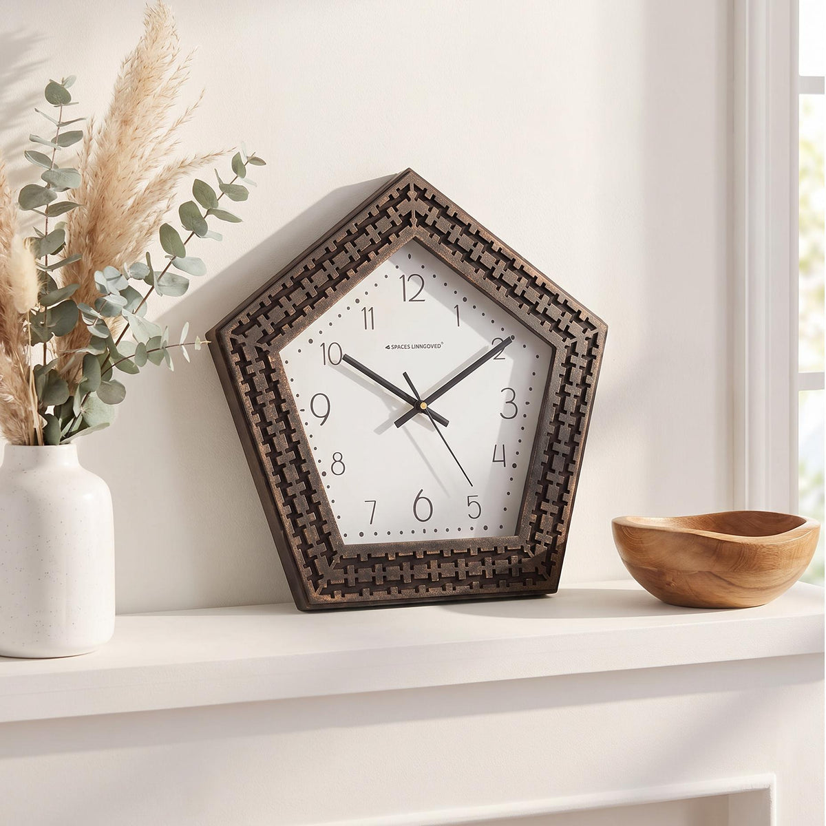 Bold black hour and minute hands with a thin white second hand on a dotted dial
