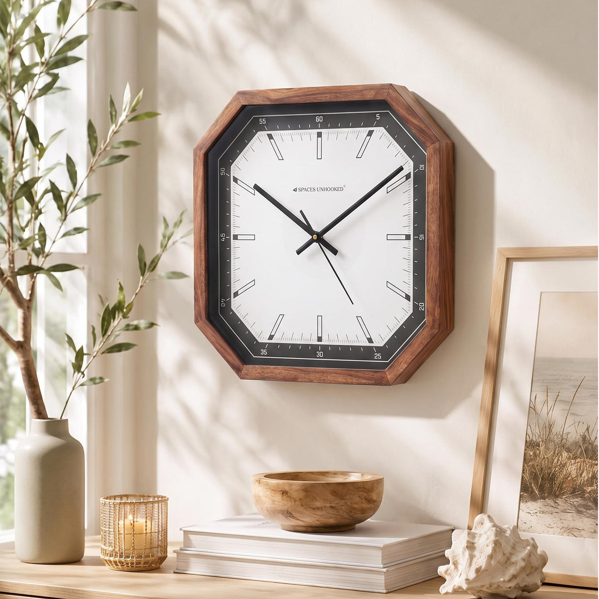 Warm brown octagonal wooden frame with natural grain around a black bezel, close-up view