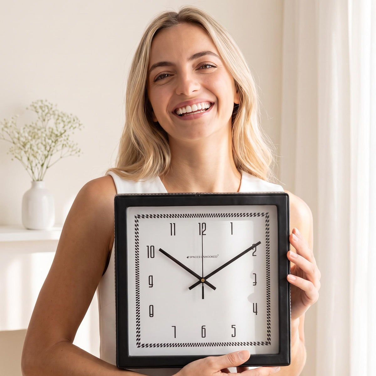 Checked border wall clock above a sideboard in a dining room