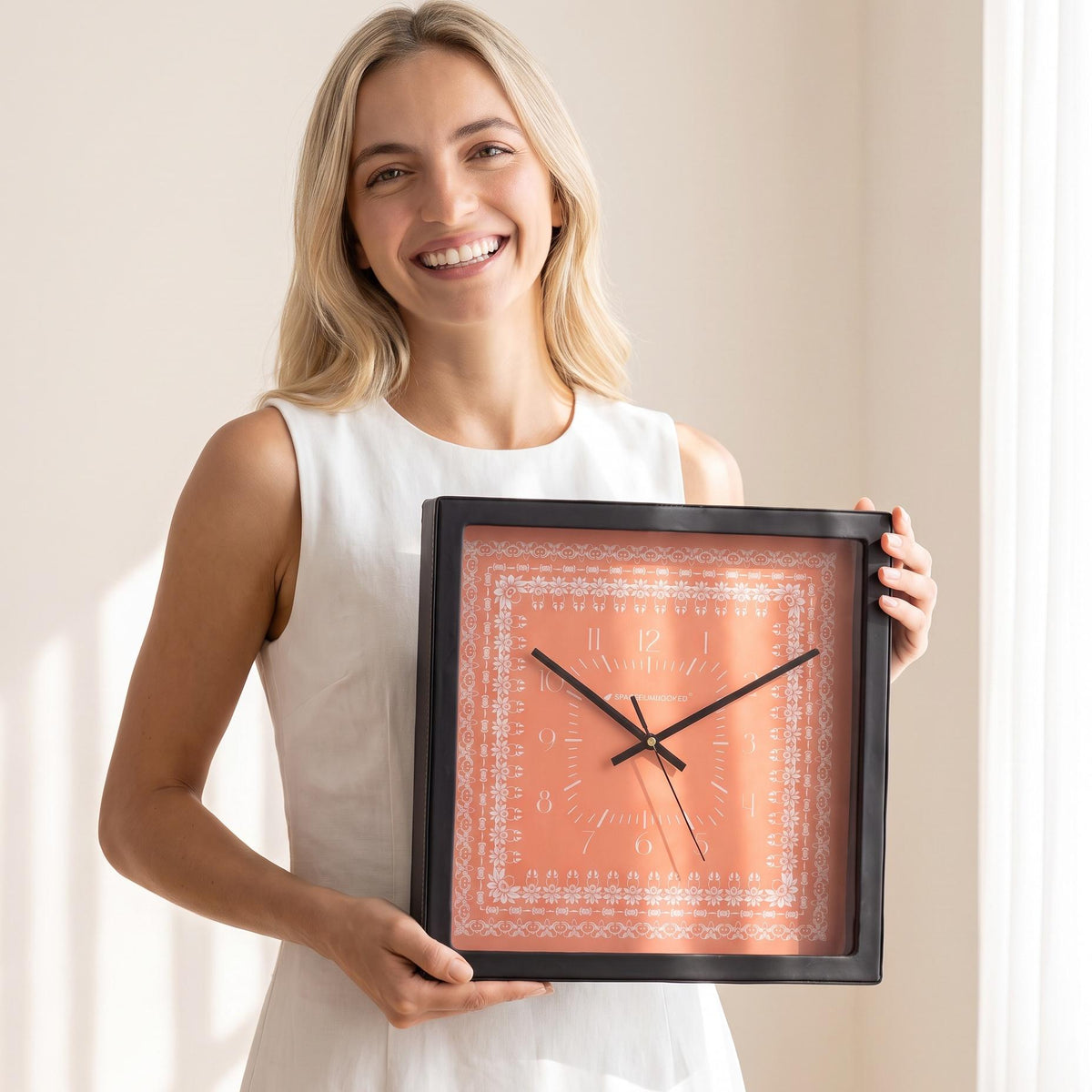 Coral floral border wall clock above a living room wall above a sofa