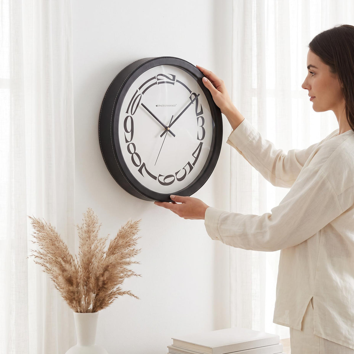 Spaces Unhooked Round Wall Clock, Melting Warped Numerals, Black Frame