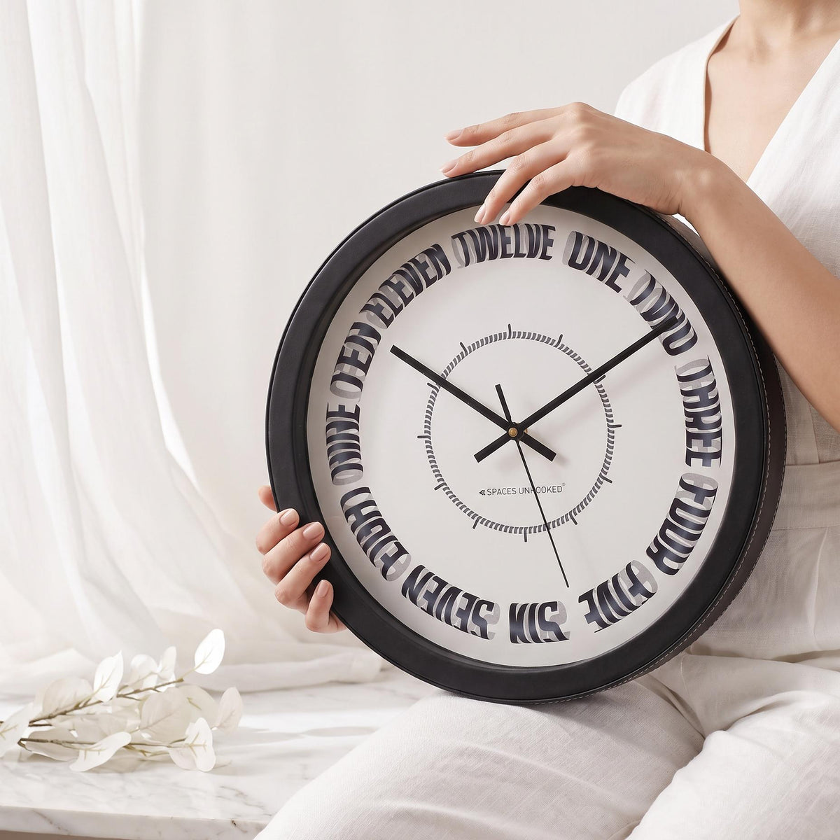 Spaces Unhooked Round Wall Clock, Curved Number Words, Black Frame