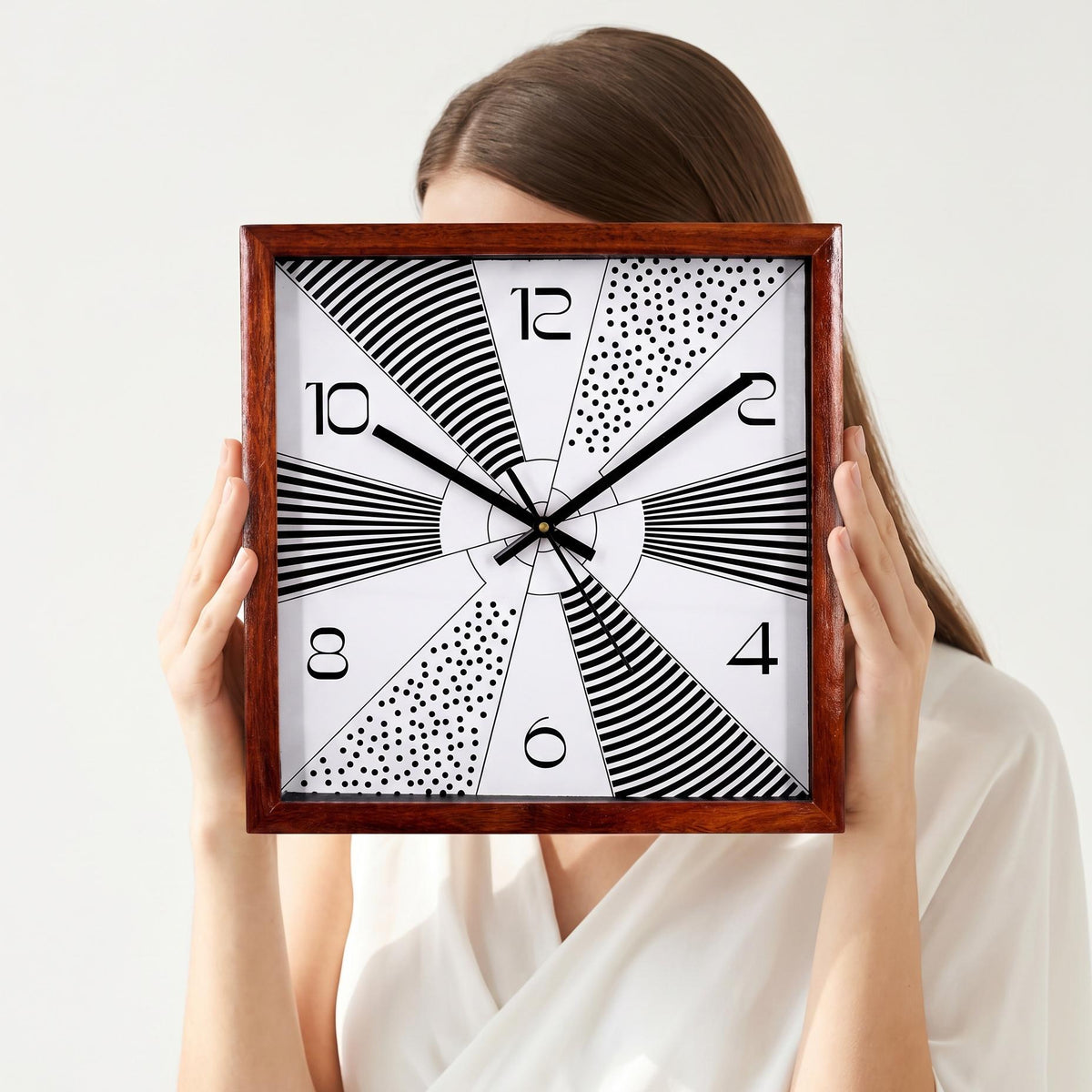 Sunburst geometric wooden wall clock as a bold focal point above a living room sofa