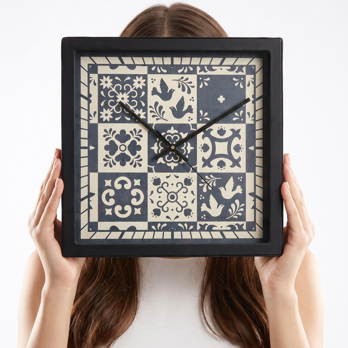 Folk art tile wall clock above a sideboard in a dining room