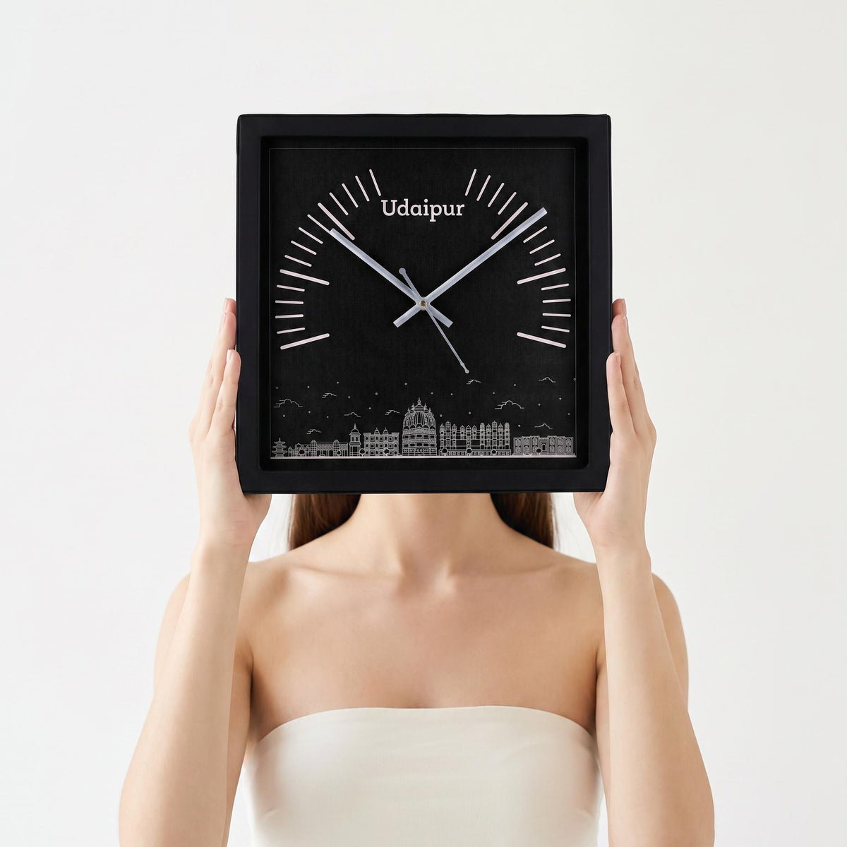 Udaipur skyline wall clock above a living room wall above a sofa
