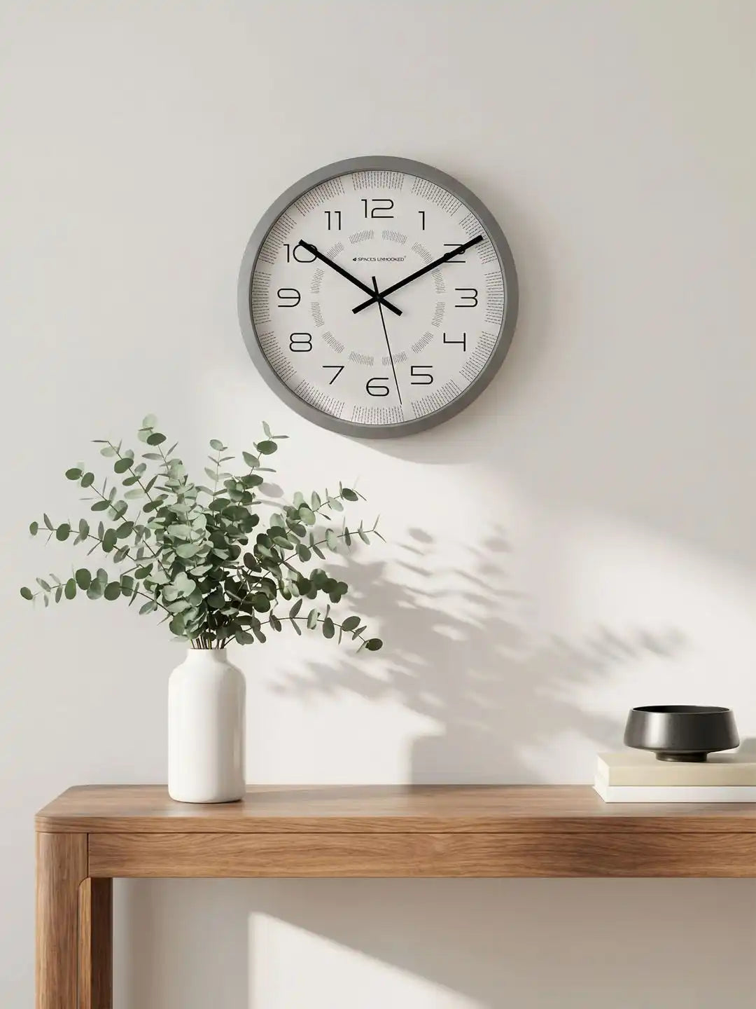 Lifestyle AI View – Premium Silent Wall Clock Mounted on Wall with Eucalyptus Decor