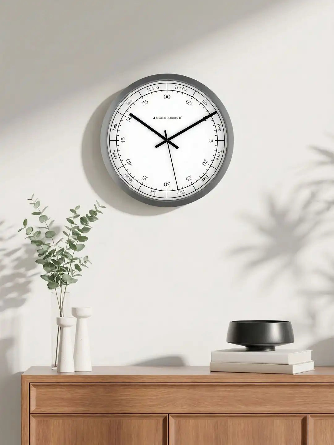Lifestyle AI View – Premium Silent Wall Clock Mounted on Wall with Eucalyptus Decor
