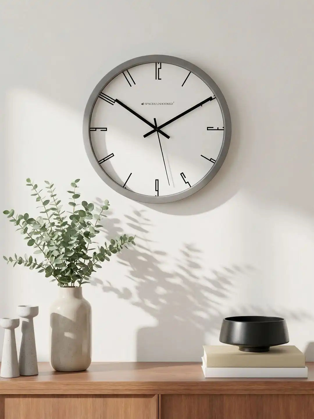 Lifestyle AI View – Premium Silent Wall Clock Mounted on Wall with Eucalyptus Decor