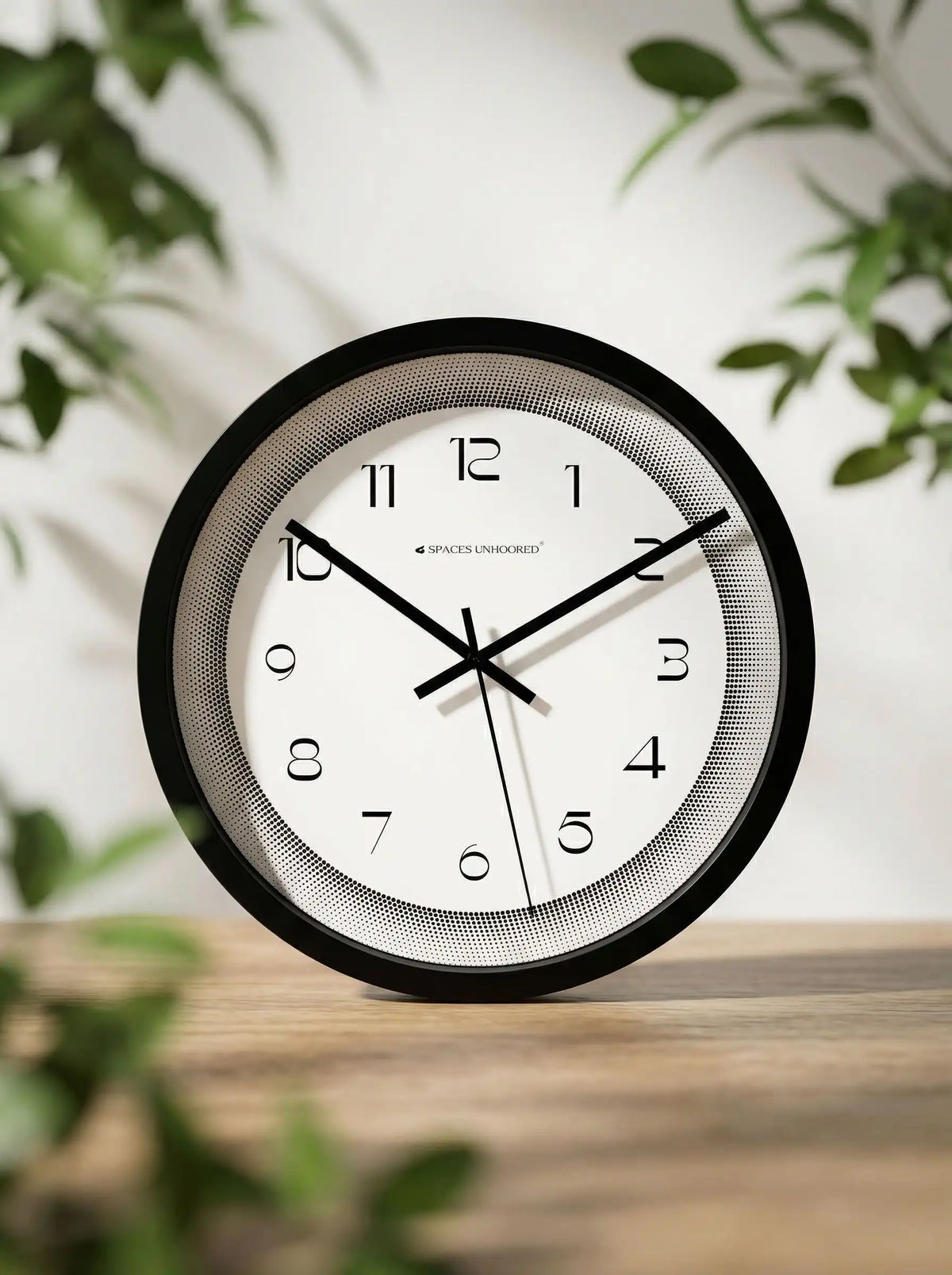Lifestyle AI View – Premium Silent Wall Clock on Wooden Table with Green Leaves
