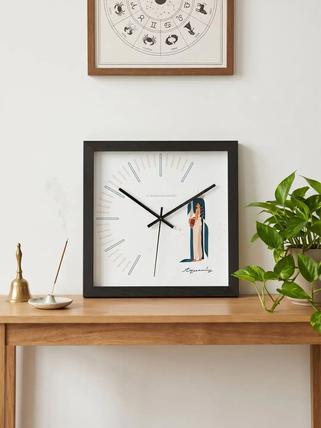 Aquarius themed wall clock with black frame highlighting hardwood construction, polished metal hands, silent quartz movement, and contemporary dial design.