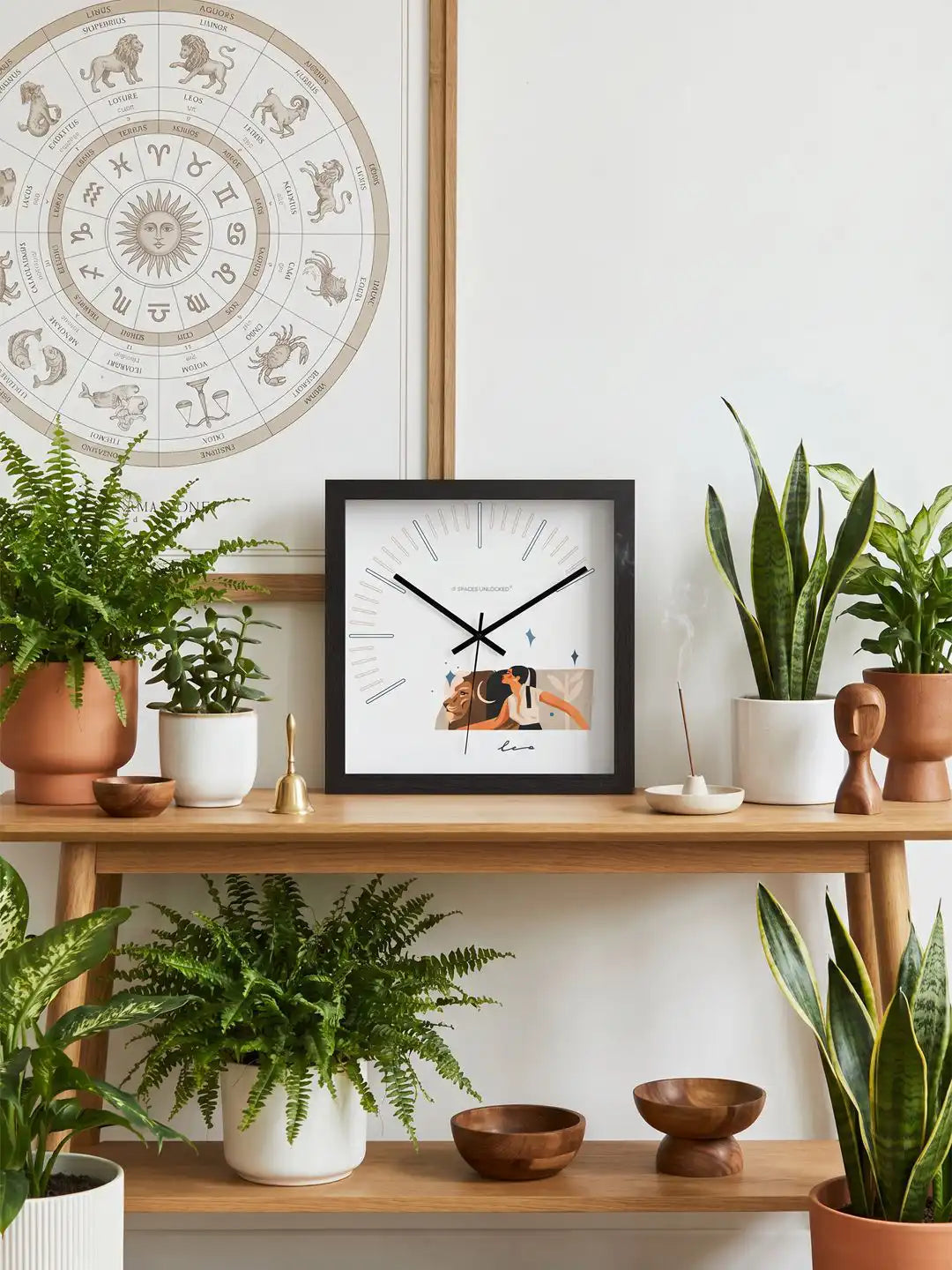 Leo wall clock close-up showing hardwood black frame, polished metal hands, contemporary dial layout, and noiseless quartz mechanism features.