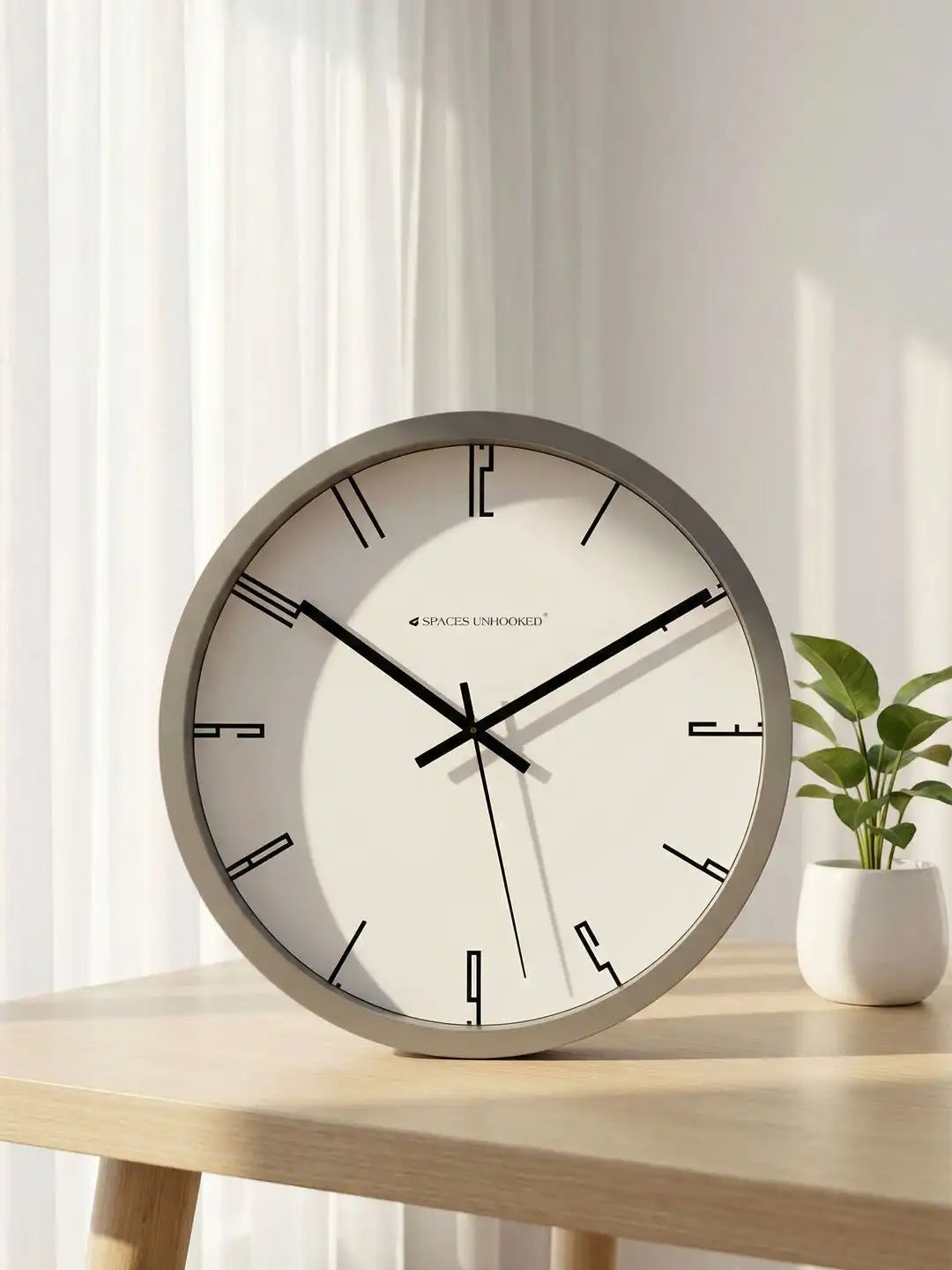 Lifestyle Wall Clock on Wooden Table – Grey Frame Minimalist Dial Designer Wall Clock for Home