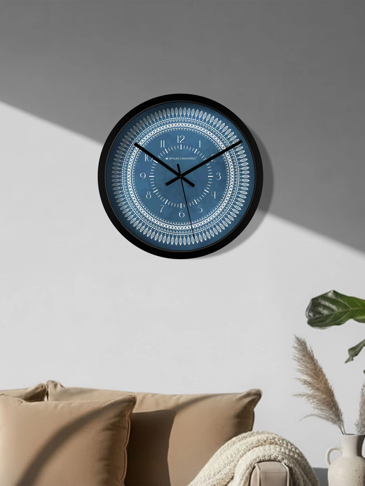 Lifestyle M – Silent wall clock placed on wooden table beside vase and book