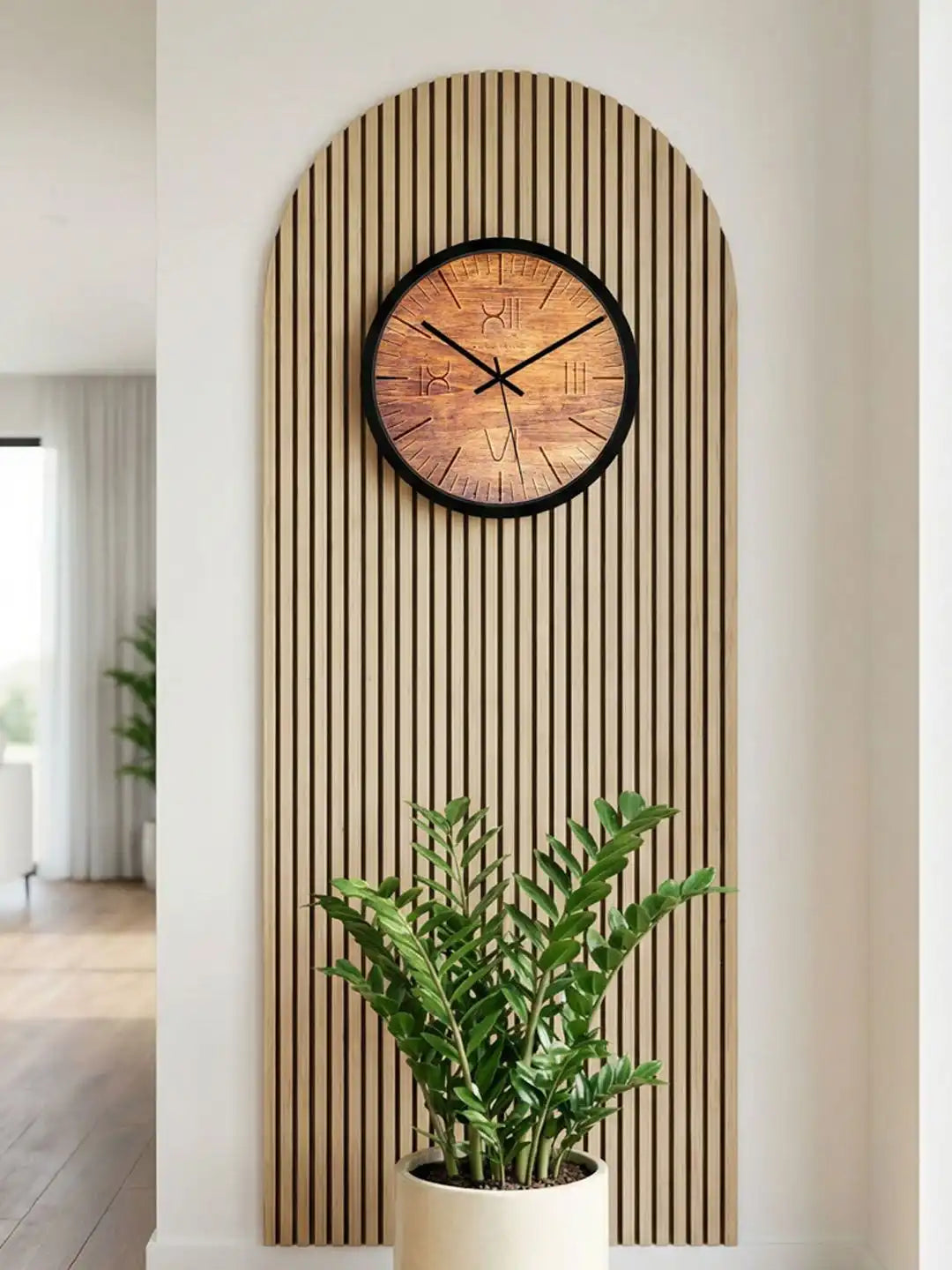 Lifestyle M – Wooden wall clock mounted on wood-paneled wall above plant decor