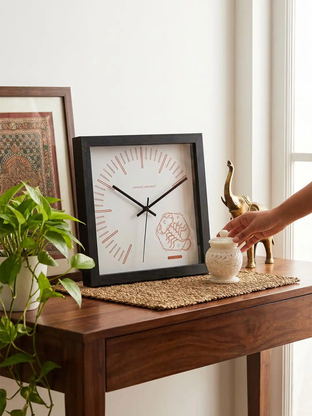 Square Dark Wood Frame Wall Clock with Copper Scorpio Design on Wooden Console Table - Wooden Wall Clock for Living Room