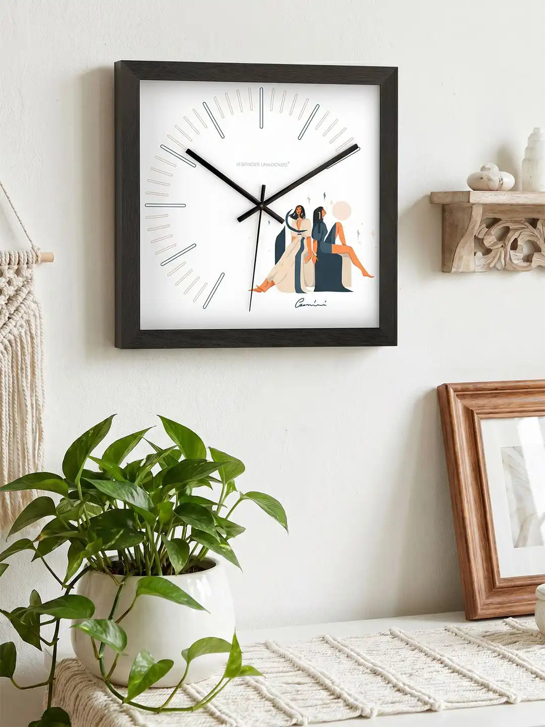 Gemini zodiac wall clock displayed alongside branded Spaces Unhooked packaging box, highlighting premium presentation and gifting appeal.
