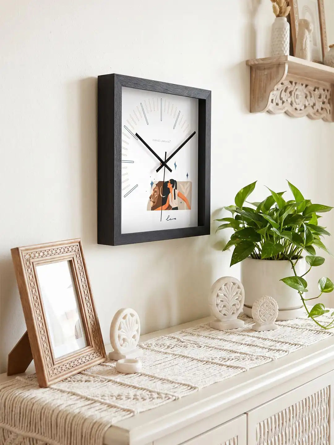 Leo zodiac wall clock with premium packaging box, featuring modern astrology-inspired artwork, black frame, and silent movement.