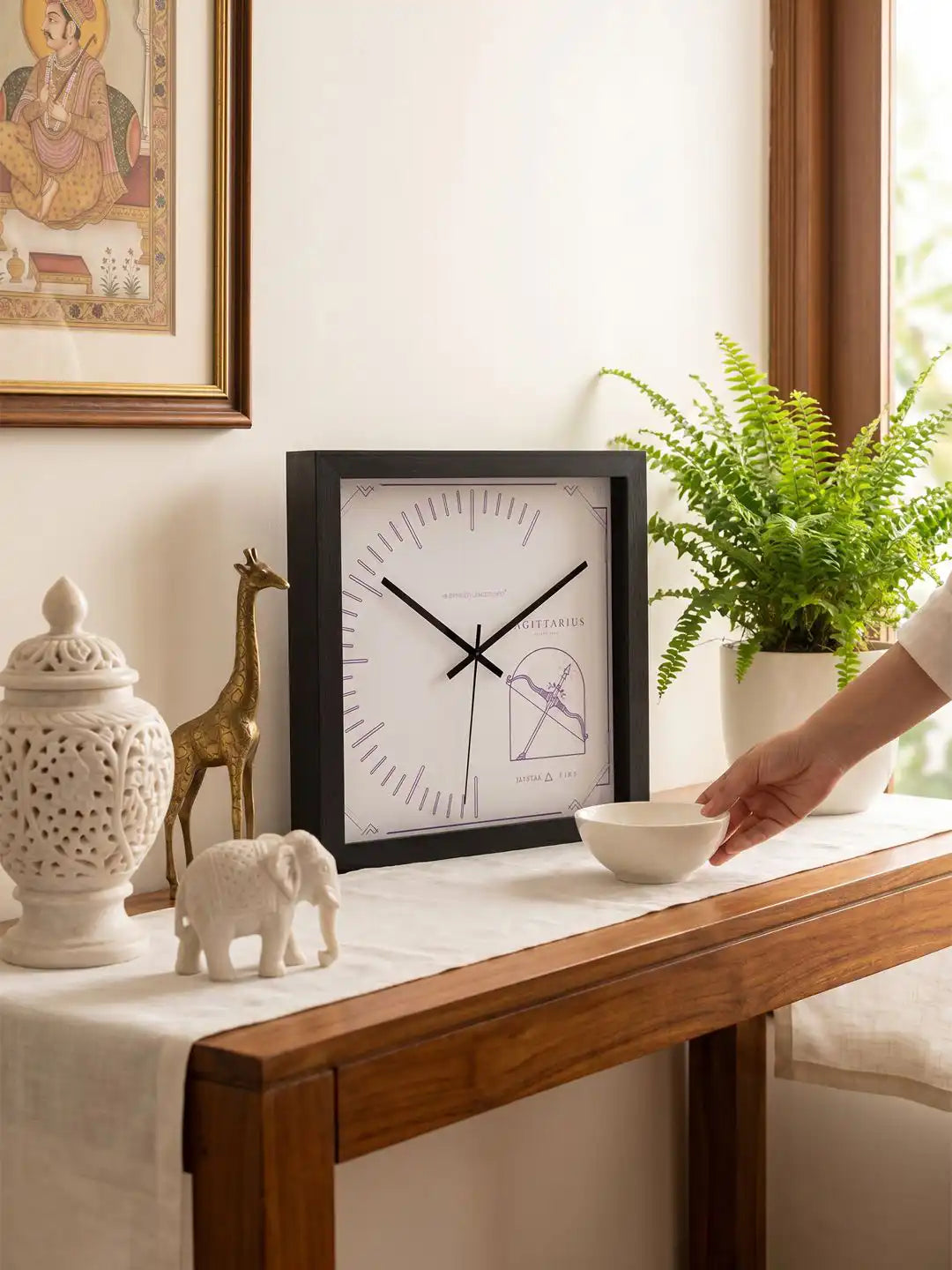 Wooden wall clock Sagittarius design placed on console table, natural wood clock aesthetic, wood frame wall clock for elegant home decoration