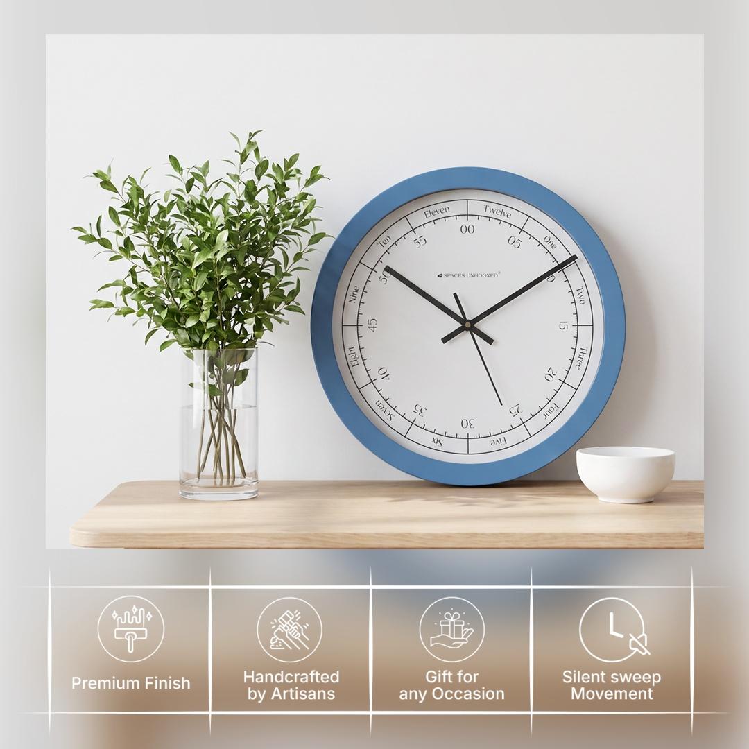 Blue round hours in words wall clock in a classroom, nursery or bright, airy kitchen
