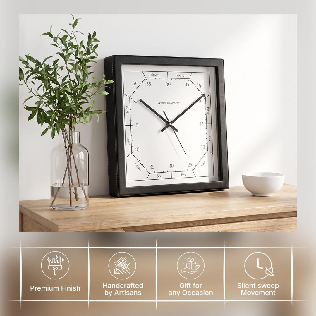 Bold black hour and minute hands over an inner octagon minute track