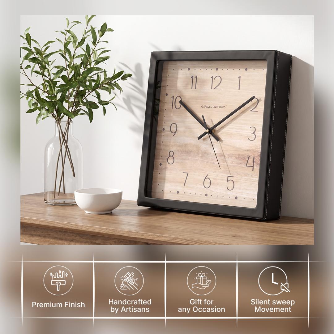 Black hour and minute hands with a thin second hand over a wood-grain dial