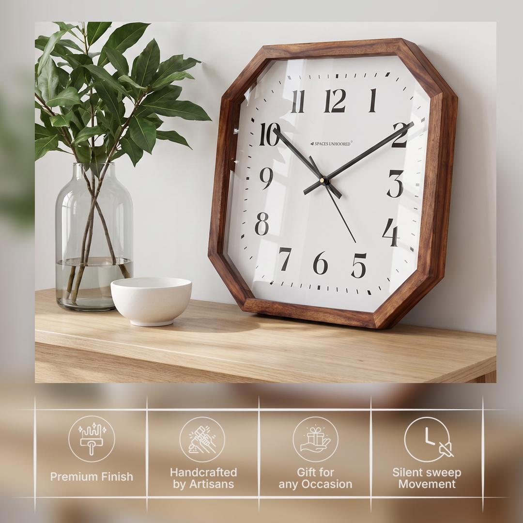Slim black hour, minute and second hands over fine minute markers on an octagonal clock dial