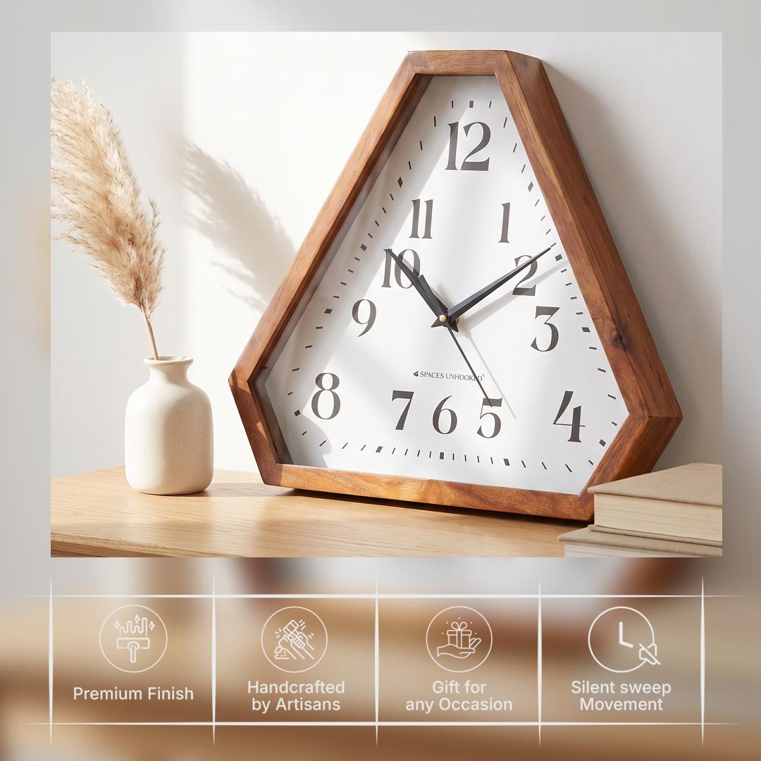 Slim black hour, minute and second hands over fine minute markers on a triangular clock dial