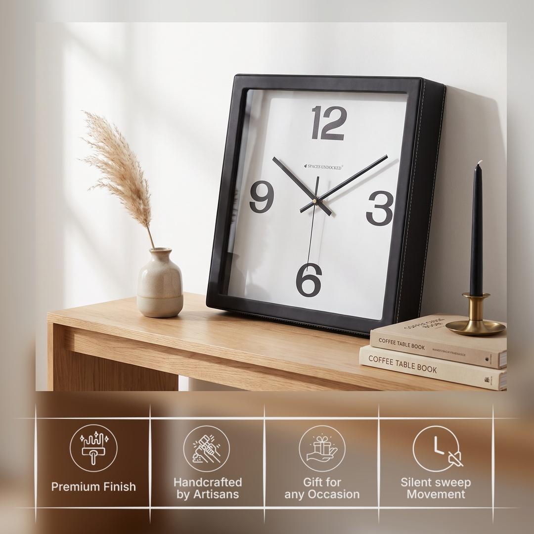 Black hour and minute hands with a thin second hand on a plain white dial