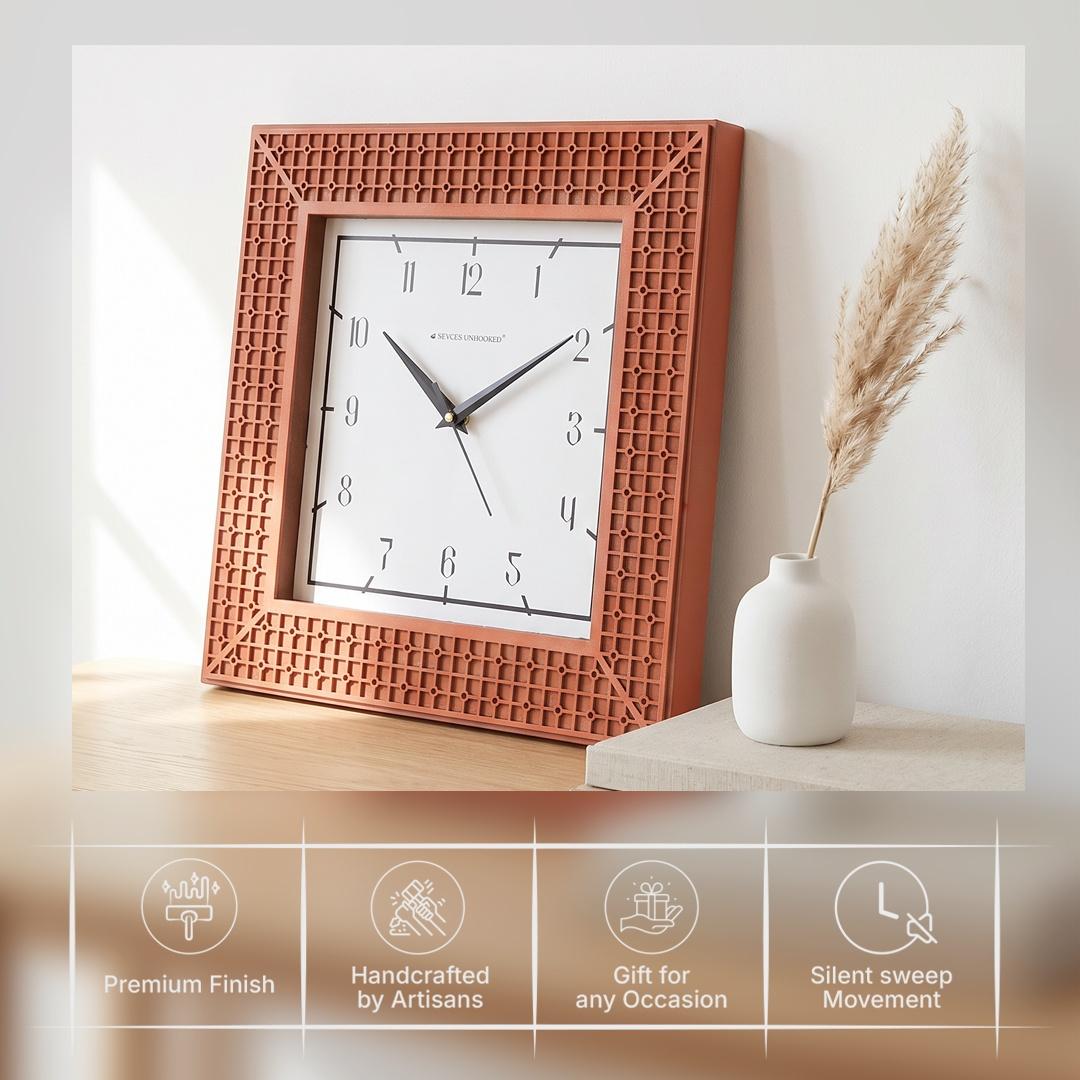 Terracotta lattice wall clock on a hallway wall above a console