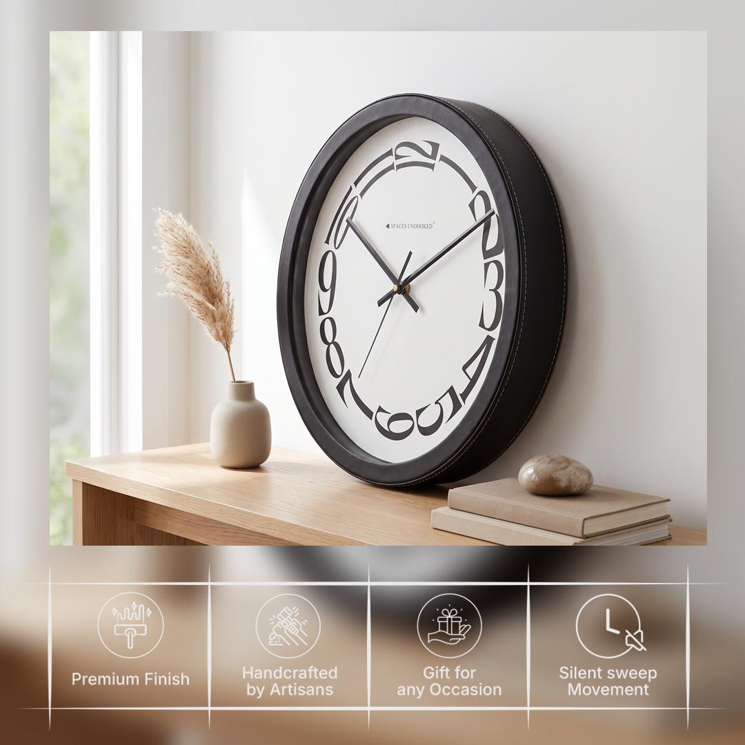 Spaces Unhooked Round Wall Clock, Melting Warped Numerals, Black Frame