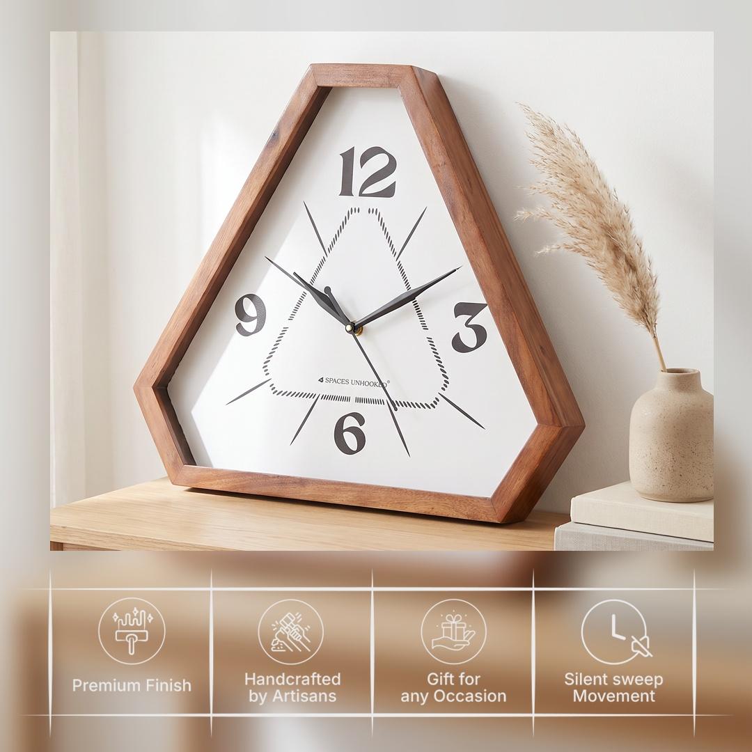 Long tapering line markers radiating across the white dial of a triangular wooden wall clock