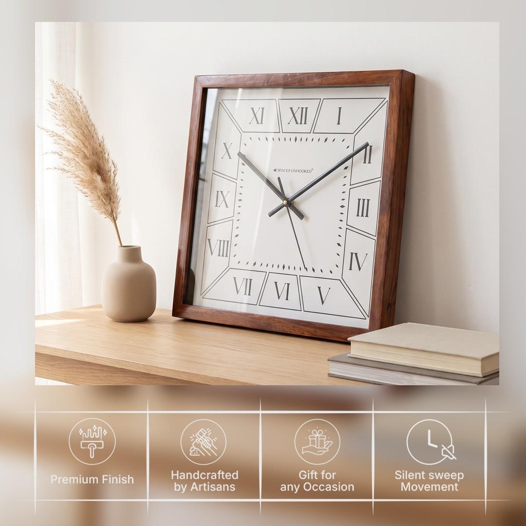 Diamond-shaped minute markers around the open white centre of a Roman numeral wall clock