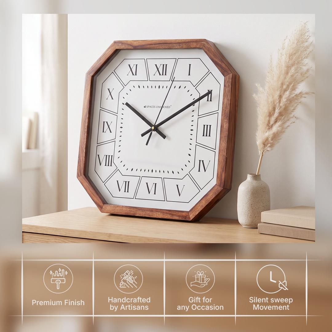 Diamond-shaped minute markers around the open white centre of a Roman numeral wall clock