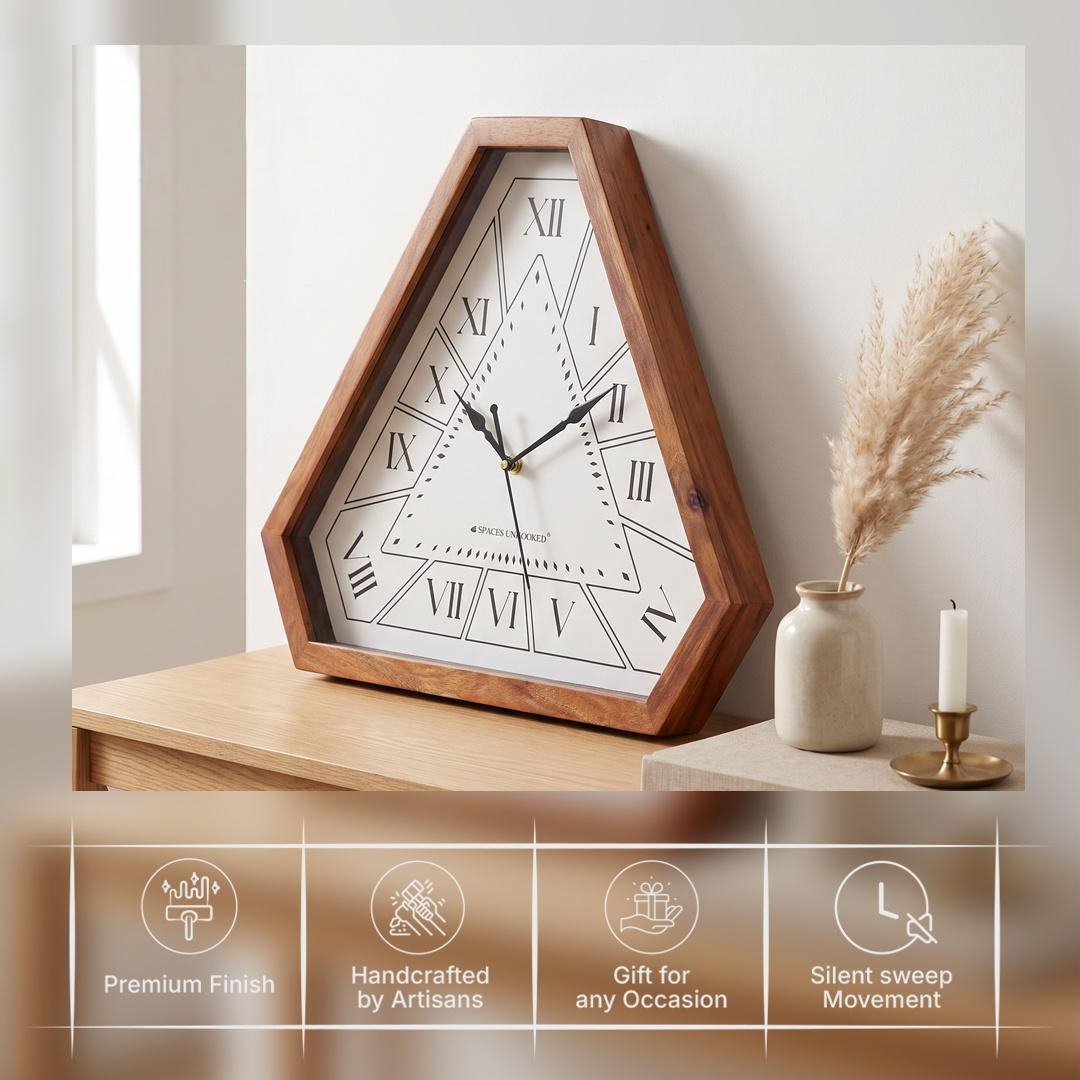 Diamond-shaped minute markers around the open white triangle of a Roman numeral wall clock