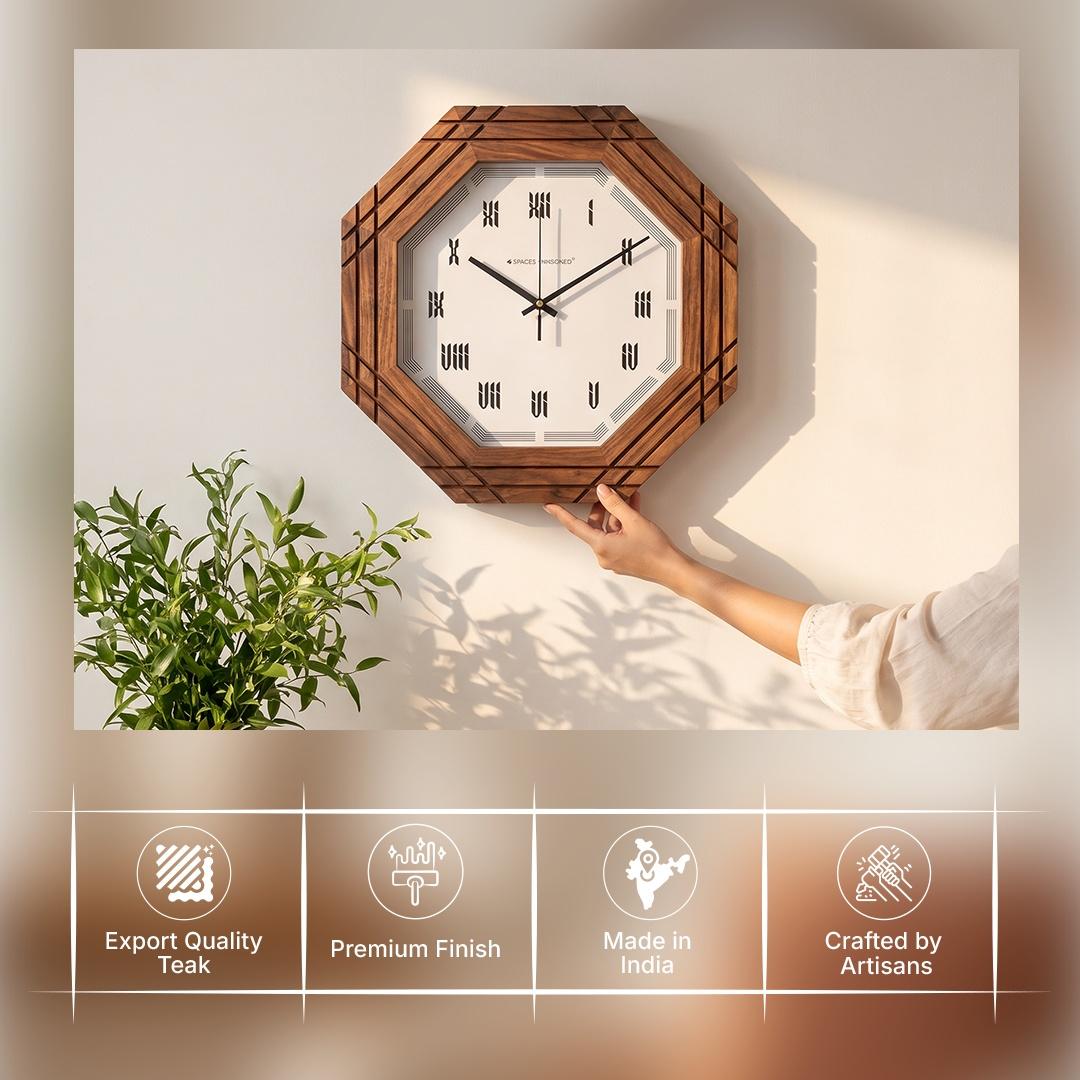 Carved wooden roman wall clock on a hallway wall above a console