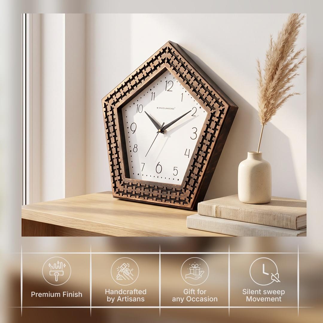 Pentagon copper weave wall clock on a study wall beside a bookshelf
