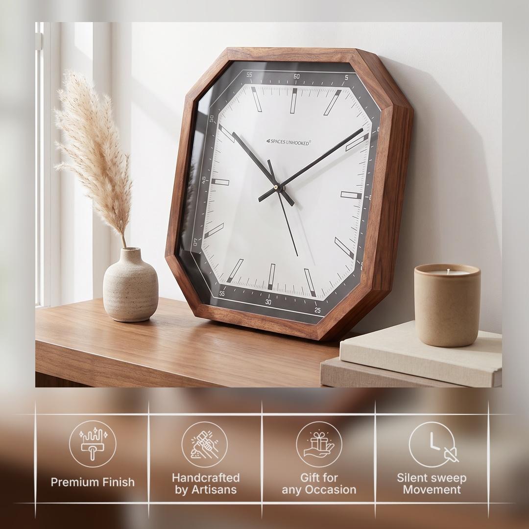 Bar-style hour markers and fine minute lines on the white dial of an octagonal wooden clock