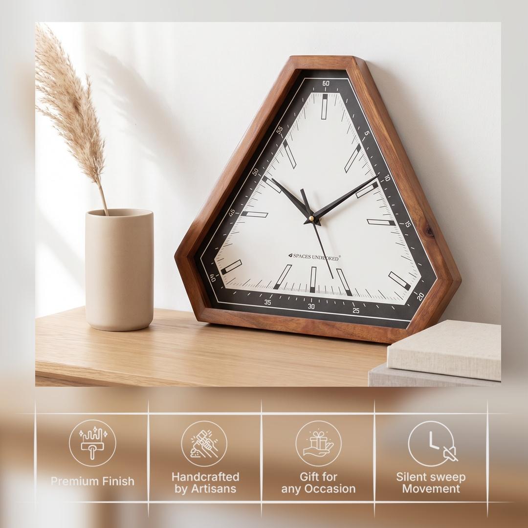 Bar-style hour markers and fine minute lines on the white dial of a triangular wooden clock