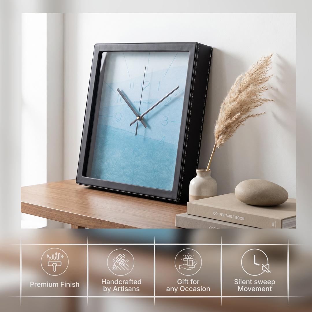 Black hour and minute hands over a sky blue watercolour dial with fine lines