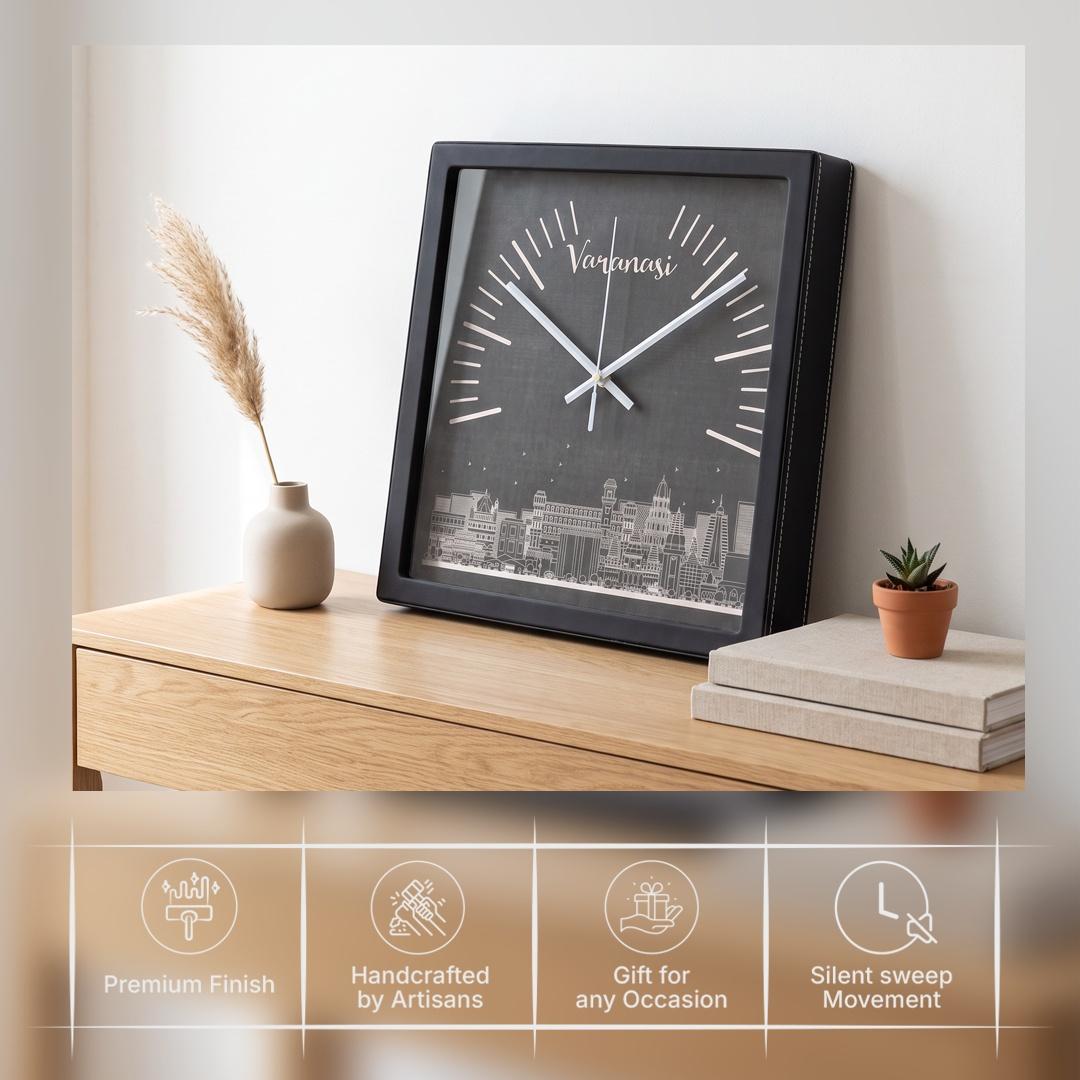White hands over white radial markers on a charcoal clock dial